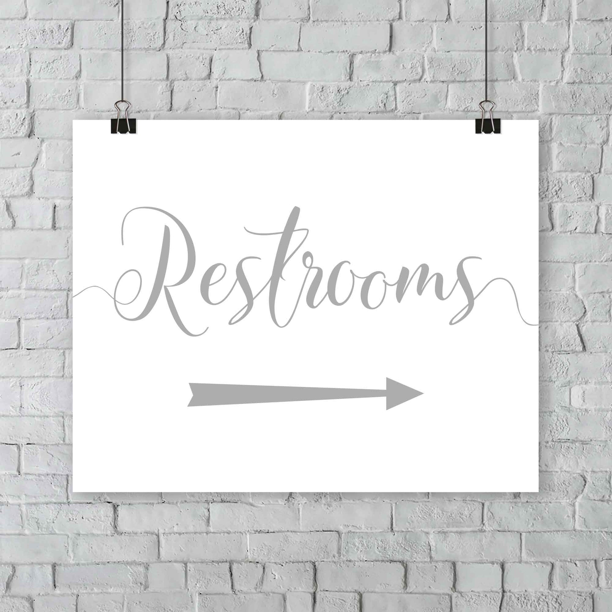 silver wedding restrooms arrow signage hanging from a wall