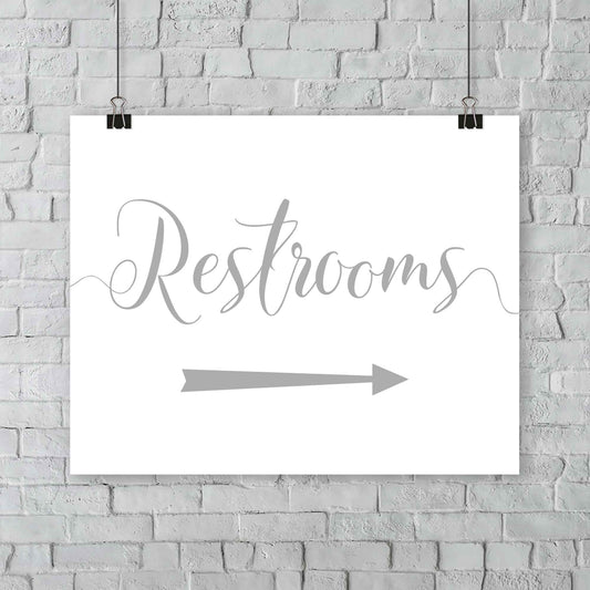 silver wedding restrooms arrow signage hanging from a wall