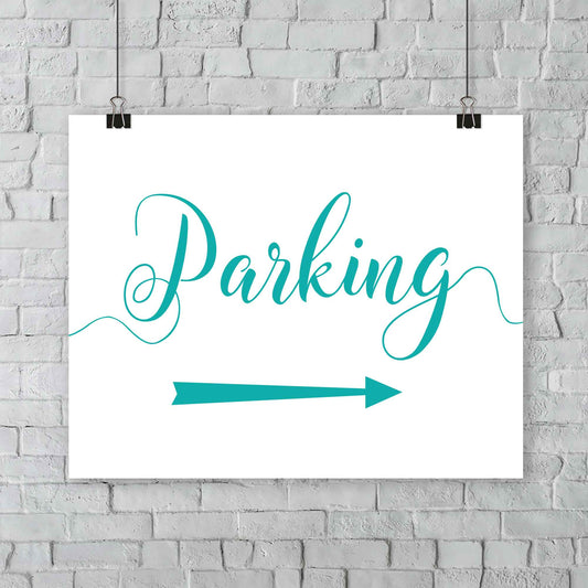 teal parking lot arrow sign hanging from a wall