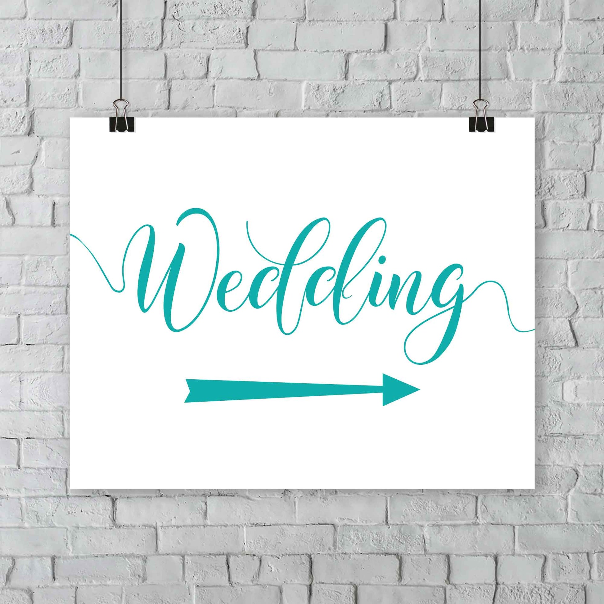 teal wedding arrow sign print hanging from a wall