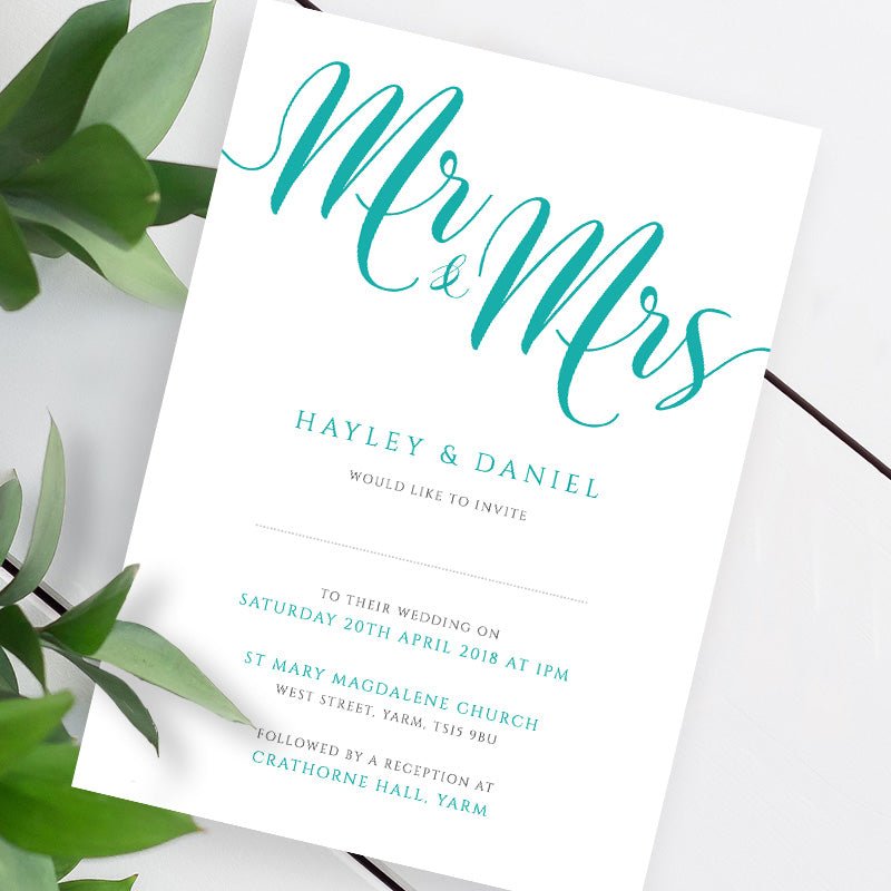 teal wedding invitation template on a white table