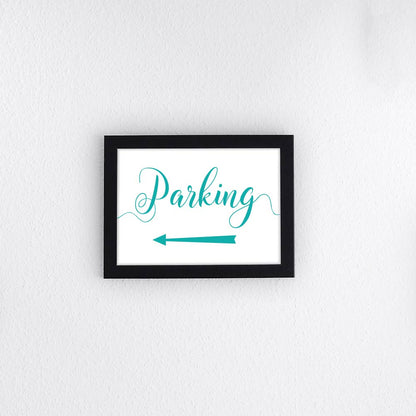 turquoise directional parking sign with arrow pointing left