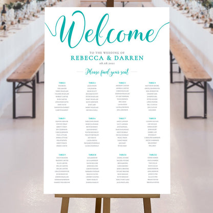 turquoise seating chart at an outdoor wedding