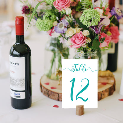 turquoise table number on a wedding reception table