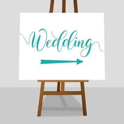 turquoise wedding arrow sign on easel
