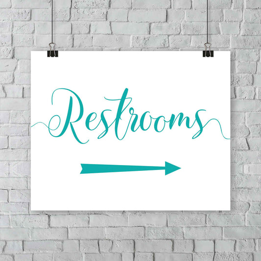 turquoise wedding restrooms arrow signage hanging from a wall