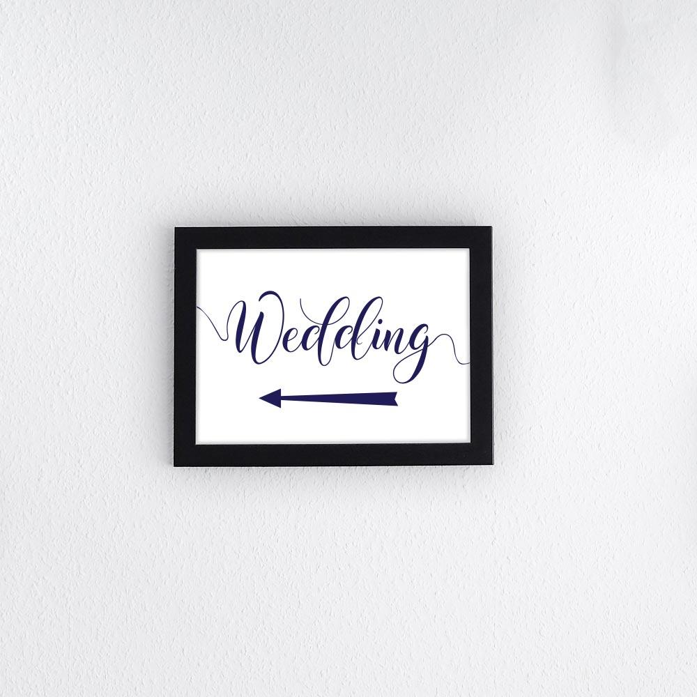 navy wedding sign with arrow pointing left