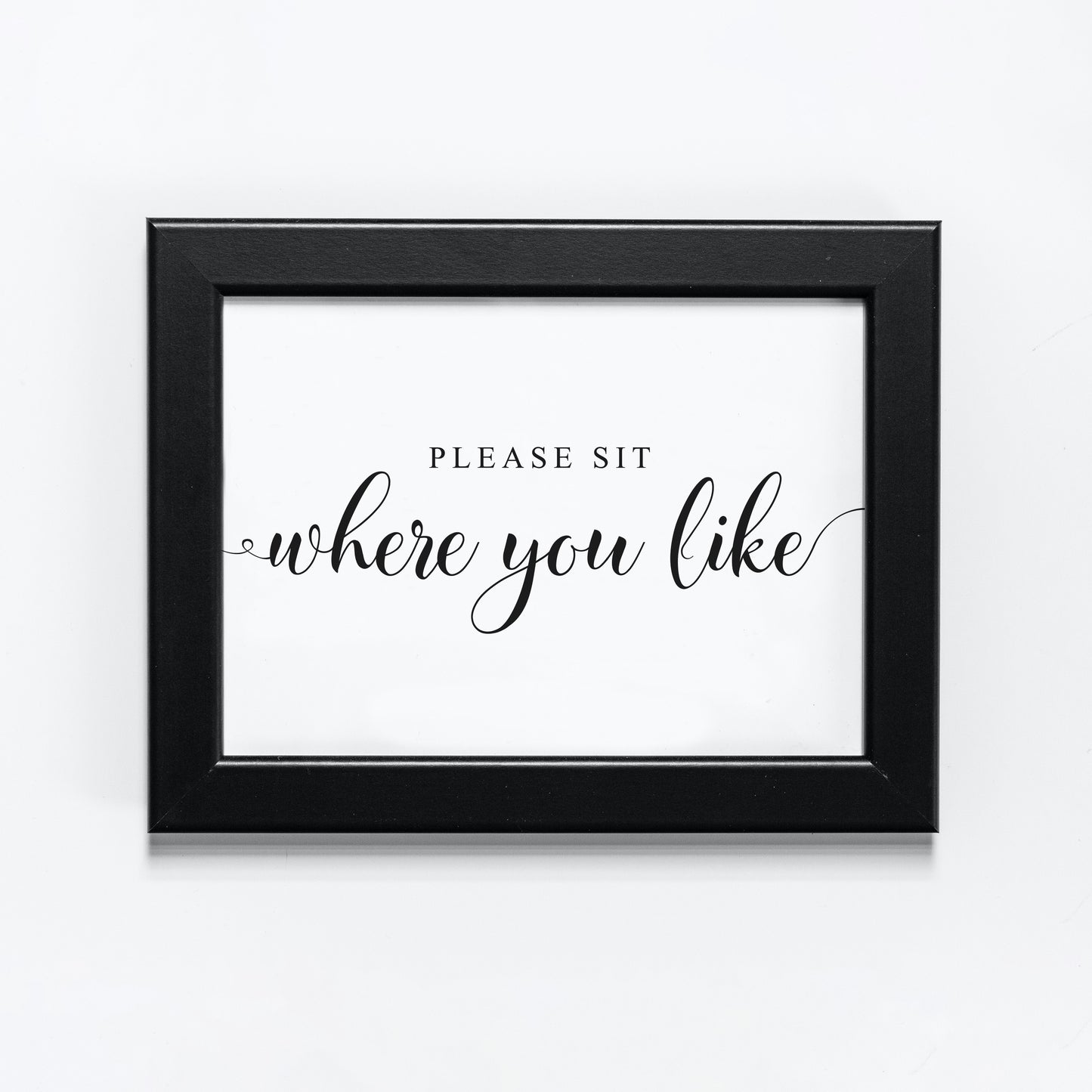 wedding seating sign in a black frame