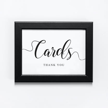 black and white wedding cards sign in a frame
