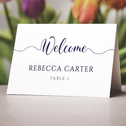 navy folded name cards on a wedding table