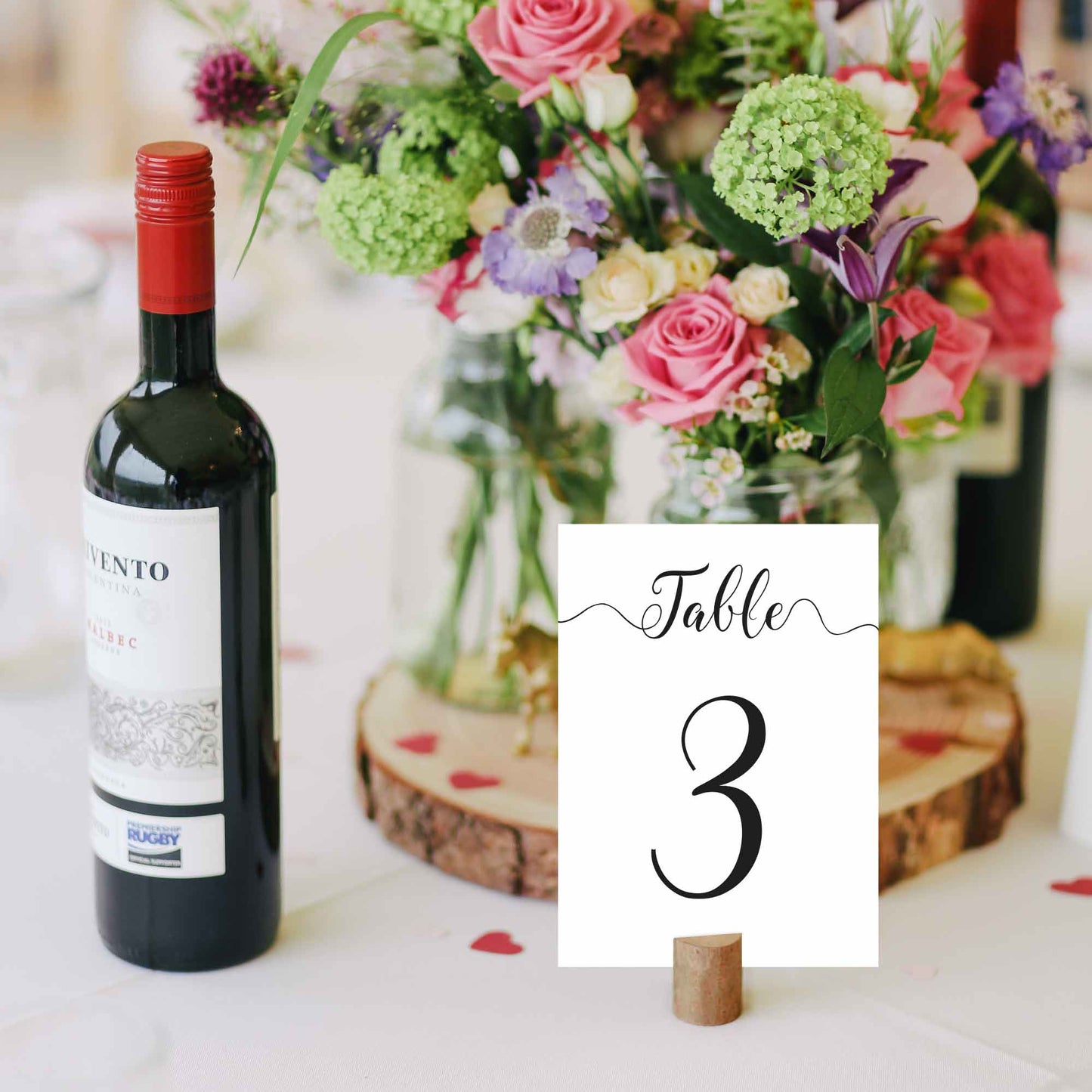 printed table number in a cork stand on a wedding table