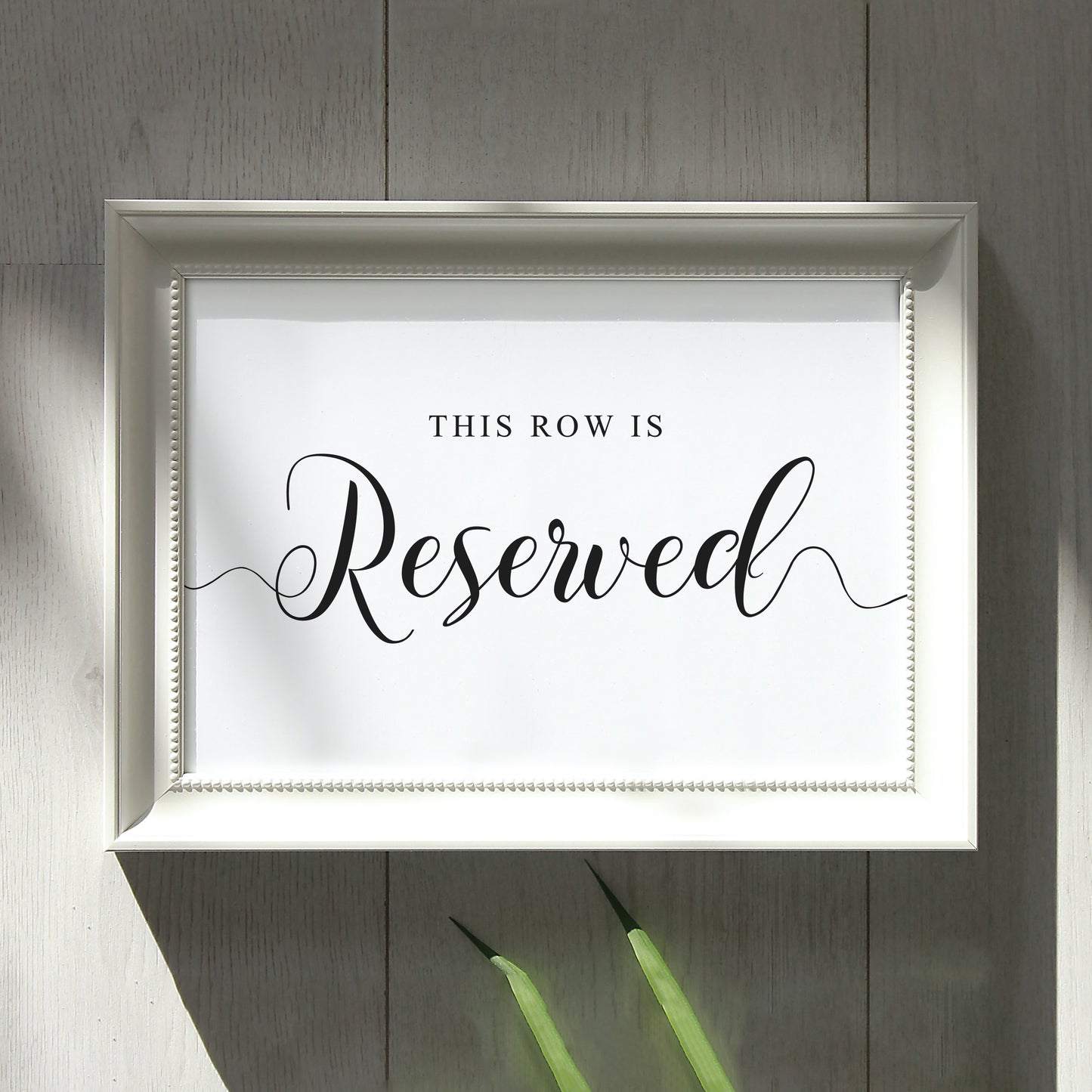 Reserved seats wedding sign in white frame