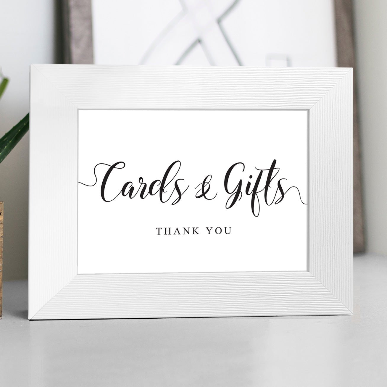elegant cards and gifts sign in a white frame