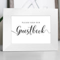 Please sign our guestbook wedding sign in a white frame