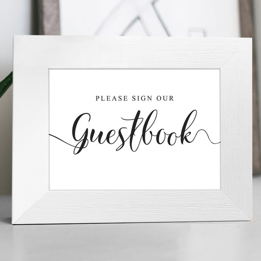 Please sign our guestbook wedding sign in a white frame